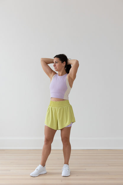 Side view of EMIÉ Just Run Crop Tank lilac showing fitted silhouette for women runners